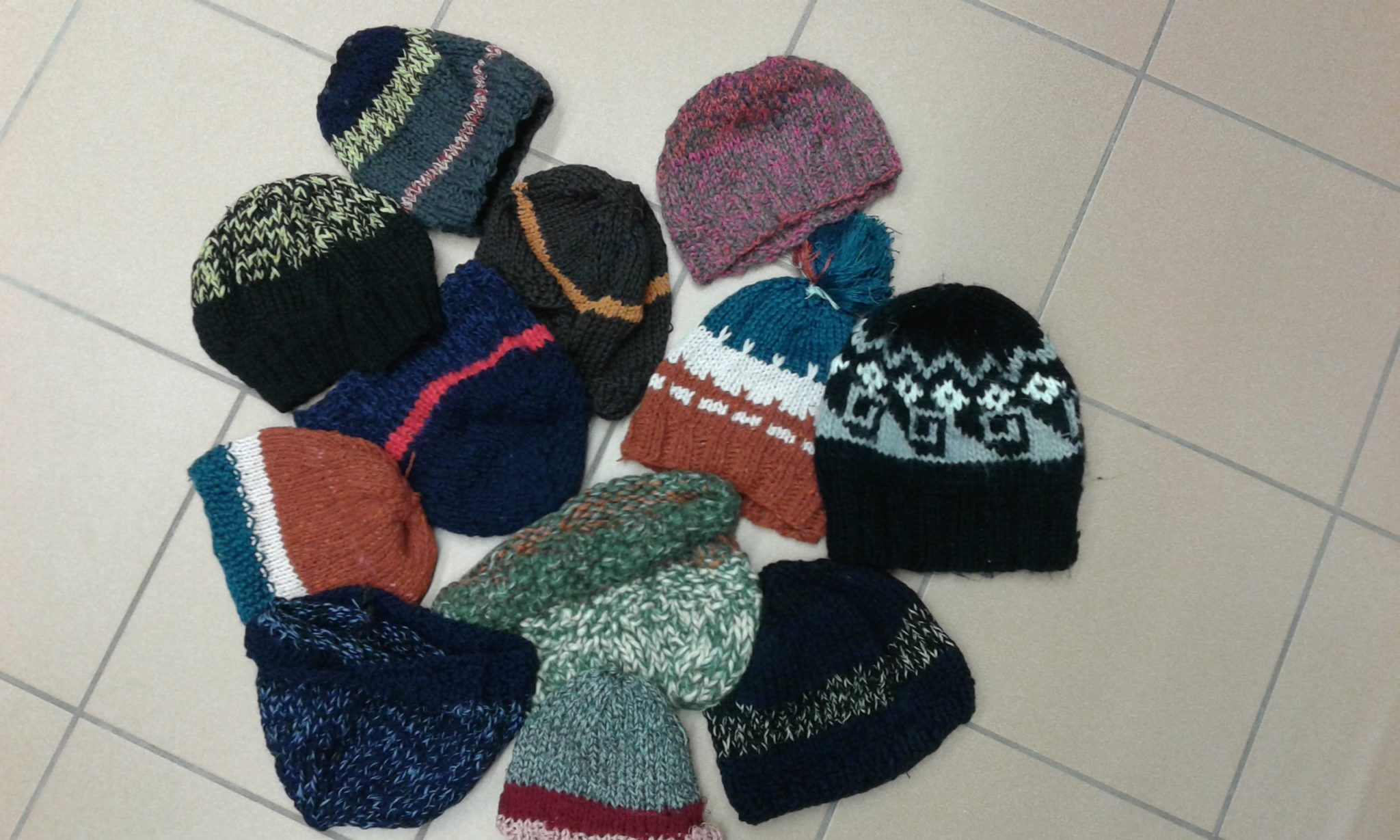 Un'immagine che ritrae di lana, berretto di maglia, copricapo, lana e tessile.